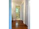 Hallway view of a remodeled bathroom with a glass enclosed shower at 211 Worthington St, Shelby, NC 28150
