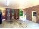 Spacious garage featuring a brick exterior, lighting, and concrete floor at 211 Worthington St, Shelby, NC 28150