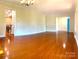 Spacious living room with hardwood floors, neutral paint, and open layout at 211 Worthington St, Shelby, NC 28150