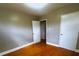 Inviting bedroom with hardwood floors and a neutral color scheme, ready for your personal touch at 215 E K St, Newton, NC 28658