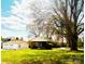 Full view of the home and detached garage with a large lawn at 215 E K St, Newton, NC 28658