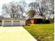 Detached garage and exterior of home with a large lawn at 215 E K St, Newton, NC 28658