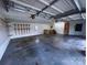 Open garage space providing a work area, natural lighting, and plenty of potential at 215 E K St, Newton, NC 28658