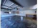 Spacious garage featuring ample storage, shelving, and workbench area at 215 E K St, Newton, NC 28658