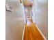 The house hallway features a hardwood floor, with several open doors, and a thermostat on the wall at 215 E K St, Newton, NC 28658