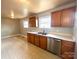 Well-lit kitchen with sleek countertops and stainless steel dishwasher at 215 E K St, Newton, NC 28658