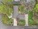 Aerial view of the home showcasing the roof, driveway, and landscaping at 2600 Gemway Dr, Charlotte, NC 28216