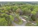 Aerial view of property surrounded by mature trees and lush greenery at 2600 Gemway Dr, Charlotte, NC 28216
