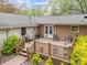 Relaxing back deck with porch swing, patio furniture and decorative lattice at 2600 Gemway Dr, Charlotte, NC 28216