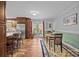 Dining area with hardwood floors, table, and access to the back deck at 2600 Gemway Dr, Charlotte, NC 28216