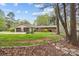 A spacious house with an attached garage surrounded by trees and green grass at 2600 Gemway Dr, Charlotte, NC 28216