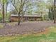 Charming brick ranch with double front doors and a beautifully landscaped front yard at 2600 Gemway Dr, Charlotte, NC 28216