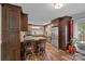 Stunning kitchen with wood cabinets, island with seating, granite countertops and stainless steel appliances at 2600 Gemway Dr, Charlotte, NC 28216