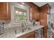 Well-equipped kitchen offers granite counters, stainless dishwasher and sink, and a window with a view at 2600 Gemway Dr, Charlotte, NC 28216