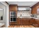 Modern kitchen with stainless steel appliances, custom cabinetry, and granite countertops at 2600 Gemway Dr, Charlotte, NC 28216