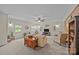 Spacious living room with a ceiling fan, neutral walls, and bright natural light at 2600 Gemway Dr, Charlotte, NC 28216