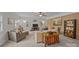 Large living room with brick accent wall, plenty of seating, and bright natural light at 2600 Gemway Dr, Charlotte, NC 28216
