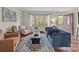 Well-appointed living room with a large window, hardwood floors, and a stylish rug at 2600 Gemway Dr, Charlotte, NC 28216