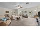 Spacious living room with lots of seating, carpet, natural light and overhead fan at 2600 Gemway Dr, Charlotte, NC 28216