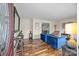 Cozy living room featuring hardwood floors, ample seating and a large front door at 2600 Gemway Dr, Charlotte, NC 28216