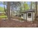 Backyard shed with stone pathway and charming landscaping at 2600 Gemway Dr, Charlotte, NC 28216