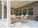 Brick patio with wicker furniture set perfect for entertaining, complete with string lighting at 2751 Collaroy Rd, Waxhaw, NC 28173