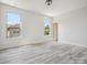 A bright, spacious bedroom with wood-look floors and lots of natural light from three windows at 2751 Collaroy Rd, Waxhaw, NC 28173
