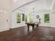 Well-lit game room with a pool table, hardwood floors, large windows, and stylish decor, perfect for entertainment at 2751 Collaroy Rd, Waxhaw, NC 28173