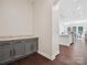 Contemporary kitchen features gray cabinets, stone countertops, and an open layout at 2751 Collaroy Rd, Waxhaw, NC 28173