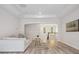 Open-concept living space with tray ceiling, neutral decor, and seamless transition to staircase at 2751 Collaroy Rd, Waxhaw, NC 28173