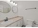 Bathroom with vanity, updated fixtures, dual mirrors, and a combination shower and tub at 333 Circle Ave # F, Charlotte, NC 28208