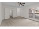 Spacious carpeted bedroom featuring natural light, a balcony, closet space, and a serene atmosphere at 333 Circle Ave # F, Charlotte, NC 28208