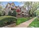 Inviting exterior showcasing a multi-story home with a sidewalk, landscaping, and charming architectural details at 333 Circle Ave # F, Charlotte, NC 28208