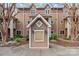 Charming exterior featuring the building number and manicured landscaping, framed by mature trees and a welcoming entrance at 333 Circle Ave # F, Charlotte, NC 28208
