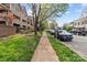 A walkable neighborhood street featuring condos, sidewalks, and parked cars at 333 Circle Ave # F, Charlotte, NC 28208