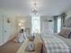 Bedroom featuring a decorated nook, a window view, and neutral carpet at 3667 Saint Andrews Ln, Gastonia, NC 28056