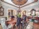 Charming dining room featuring chandelier, hardwood floors and archways at 3667 Saint Andrews Ln, Gastonia, NC 28056