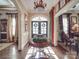Grand foyer showcasing a decorative table, arched doorways, and elegant lighting at 3667 Saint Andrews Ln, Gastonia, NC 28056