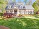 Charming brick home featuring a beautifully landscaped front yard and classic architectural details at 3667 Saint Andrews Ln, Gastonia, NC 28056