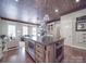 Open kitchen design with a large island, modern appliances, and adjacent living space at 3667 Saint Andrews Ln, Gastonia, NC 28056