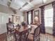 Elegant living room featuring refined decor, coffered ceiling, and detailed furnishings at 3667 Saint Andrews Ln, Gastonia, NC 28056
