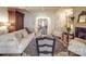 Open-concept living room with fireplace, comfortable seating, and hardwood floors at 3667 Saint Andrews Ln, Gastonia, NC 28056