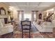 Comfortable living room with fireplace, built-in bookshelves, and cozy seating at 3667 Saint Andrews Ln, Gastonia, NC 28056