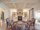Inviting living room with coffered ceilings, fireplace, and sophisticated decor at 3667 Saint Andrews Ln, Gastonia, NC 28056