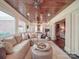 Cozy sun room with wood ceiling, open layout, and comfortable seating at 3667 Saint Andrews Ln, Gastonia, NC 28056