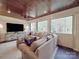 Bright sun room with wood ceilings, large windows, and comfortable seating at 3667 Saint Andrews Ln, Gastonia, NC 28056