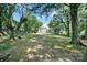 Large backyard offers ample space and is surrounded by mature trees at 407 Chesterfield Ave, Lancaster, SC 29720