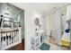 Bathroom featuring a pedestal sink, toilet, and shower with a patterned curtain at 407 Chesterfield Ave, Lancaster, SC 29720