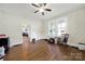 Cozy bedroom with hardwood floors, natural light, and view to a living area at 407 Chesterfield Ave, Lancaster, SC 29720