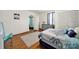 Bedroom featuring hardwood floors, a window, and a gray dresser at 407 Chesterfield Ave, Lancaster, SC 29720